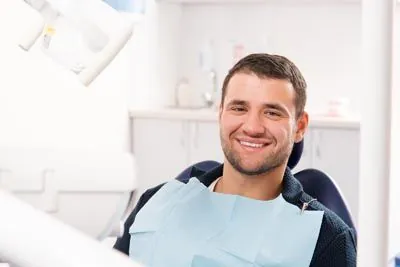 man sitting in the dental chair at Gina Biedermann DDS in Keller, TX