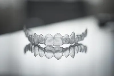 closeup of a set of Invisalign aligners on a table