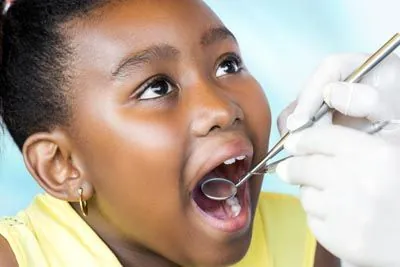 young girl receiving dental care at the office of Gina Biedermann DDS