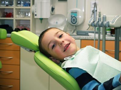 young boy smiling during his dental appointment at Gina Biedermann DDS