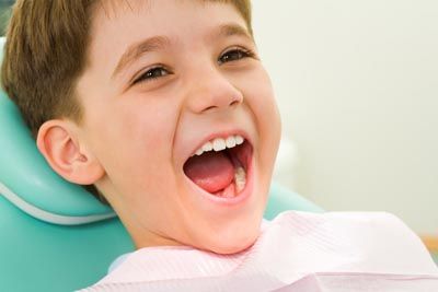 young child smiling during his dental appointment at Gina Biedermann DDS in Keller, TX