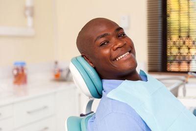 man smiling during his first visit to Gina Biedermann DDS in Keller, TX