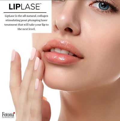 Dental assistant reviewing scan with patient in clinic